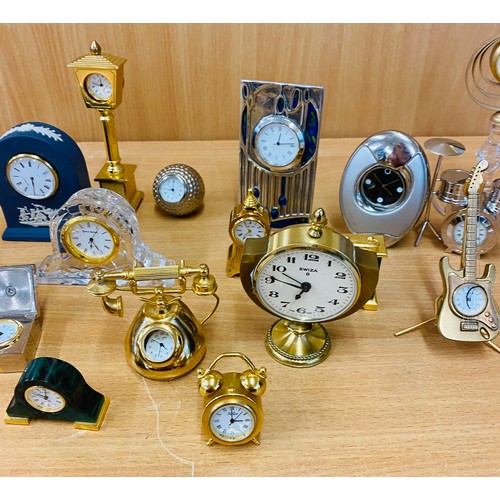 74 - Shelf of miniature novelty mantle clocks, all untested