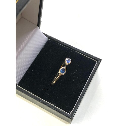 139 - 9ct gold sapphire torque ring by JAHDO weight 2.2g