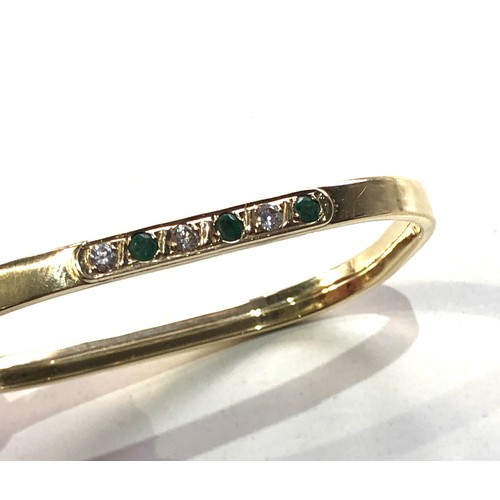 193 - 14ct gold gemstone set  bangle measures approx 6.5cm by 5.5cm weight 10g