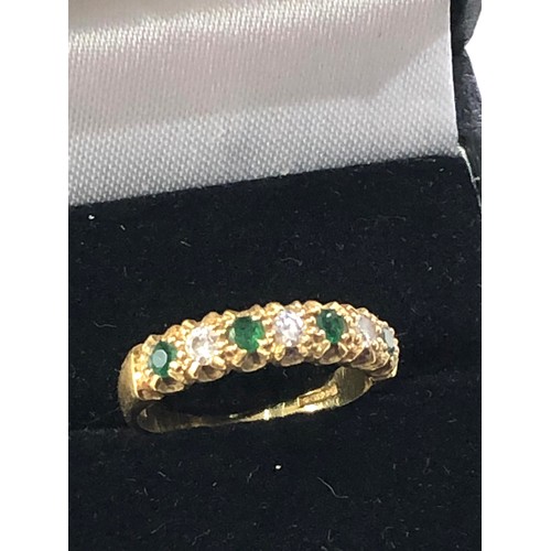 134 - 18ct gold emerald diamond half eternity ring weight 3.8g