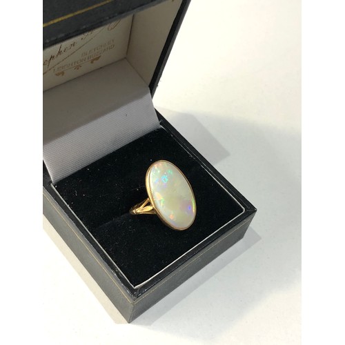 153 - 18ct gold large opal ring opal measures approx 18mm by 11mm ring weight 3.6g