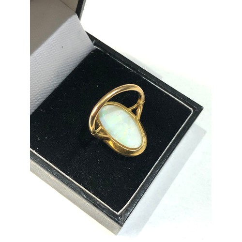 153 - 18ct gold large opal ring opal measures approx 18mm by 11mm ring weight 3.6g