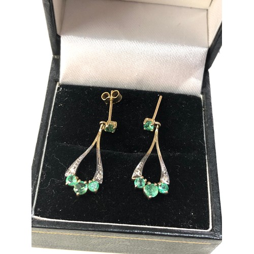 186 - 9ct gold emerald drop earrings measure approx 2.3cm missing 1 fastener as shown