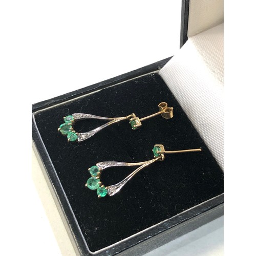 186 - 9ct gold emerald drop earrings measure approx 2.3cm missing 1 fastener as shown