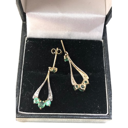 186 - 9ct gold emerald drop earrings measure approx 2.3cm missing 1 fastener as shown