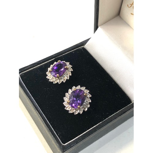 185 - 9ct gold amethyst halo earrings measure approx 1.5cm by 1.2cm weight 2.5g