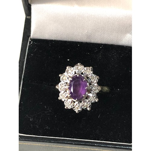 161 - 18ct gold amethyst diamond halo ring weight 4.8g