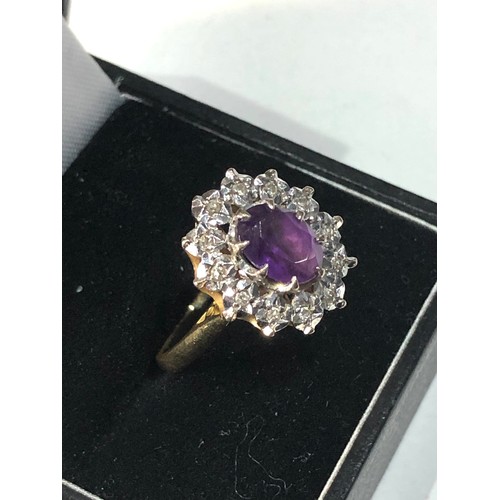 161 - 18ct gold amethyst diamond halo ring weight 4.8g