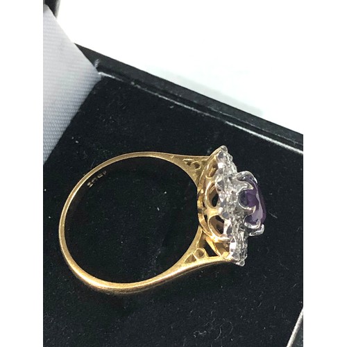 161 - 18ct gold amethyst diamond halo ring weight 4.8g