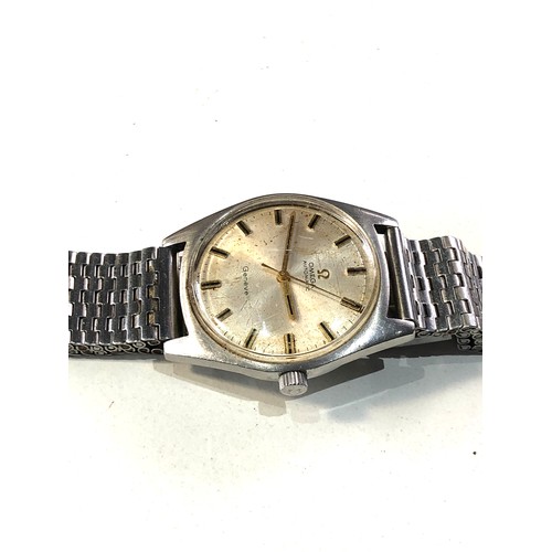 71 - Vintage Men's Omega automatic Geneve  wristwatch the watch is ticking but no warranty is given stain... 