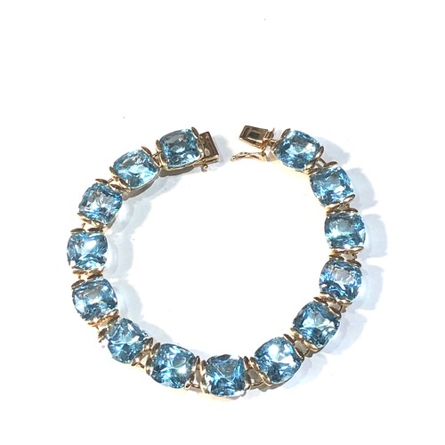 332 - 9ct gold blue gem set bracelet each gem measures approx 9mm by 9mm braclet measures approx length 17... 