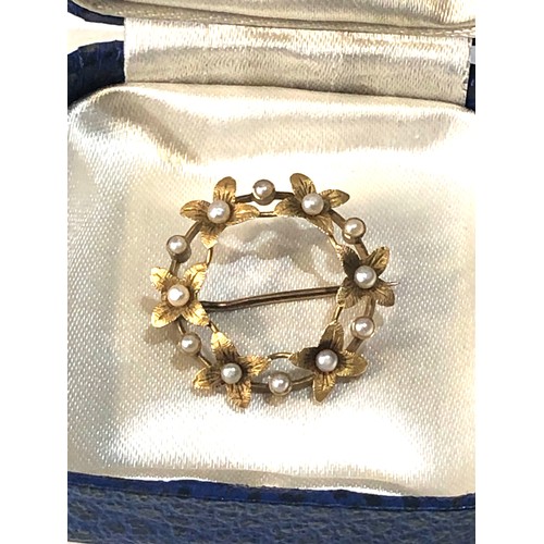 335 - Antique 15ct gold seedpearl petal brooch measures approx 2.5cm dia weight 2.5g hallmarked 15ct in go... 