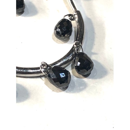 336 - White gold black diamond drop earrings measure approx 2.7 by 2.5 cm dia each set with 7 dangly black... 