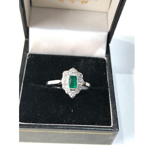 356 - Fine Platinum diamond an emerald ring central emerald 0.90ct with diamonds around 0.50ct