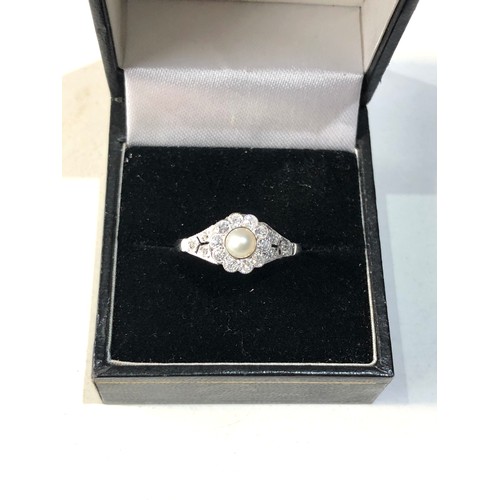 357 - Fine platinum diamond and pearl ring central pearl with diamonds around .35ct