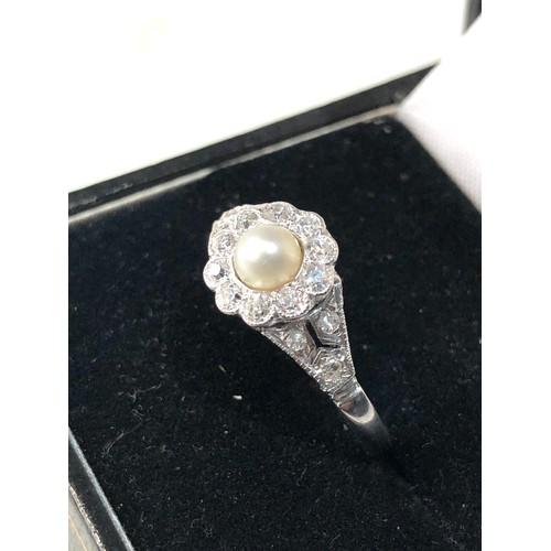 357 - Fine platinum diamond and pearl ring central pearl with diamonds around .35ct