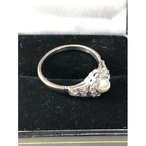 357 - Fine platinum diamond and pearl ring central pearl with diamonds around .35ct