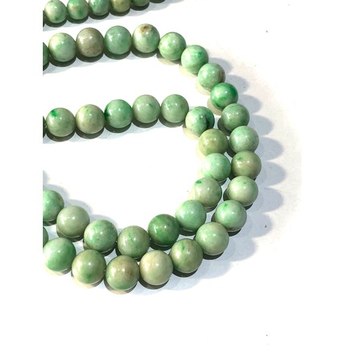 373 - Antique long jade bead necklace each bead measures approx 9mm dia measures 74cm long weight 101g gol... 