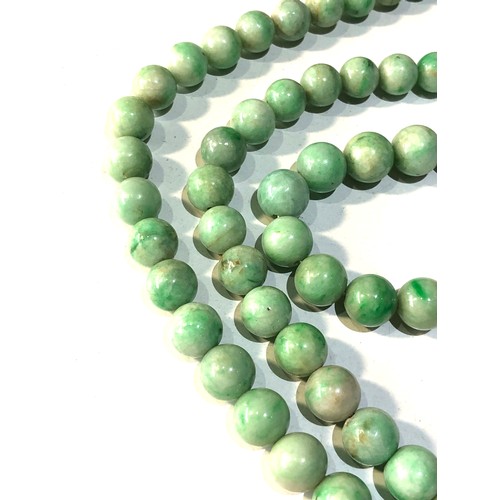 373 - Antique long jade bead necklace each bead measures approx 9mm dia measures 74cm long weight 101g gol... 