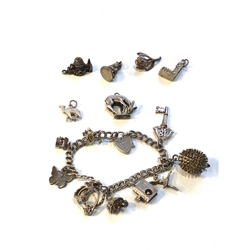 463 - Vintage silver charm bracelet and loose charms weight 45g