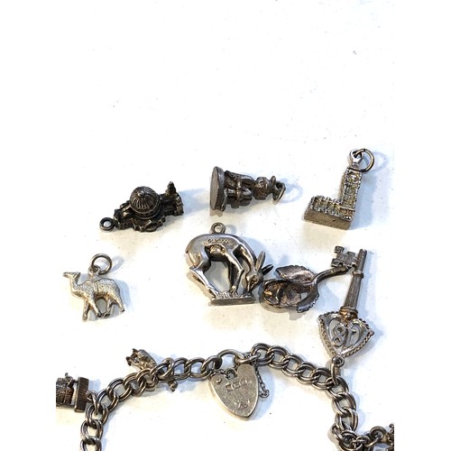 463 - Vintage silver charm bracelet and loose charms weight 45g