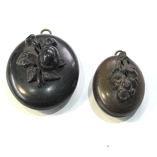 478 - 2 victorian bog oak lockets largest meaures approx 4.6cm by 3.9cm hinge in need of repair on largest... 