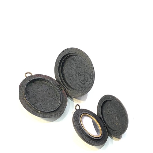 478 - 2 victorian bog oak lockets largest meaures approx 4.6cm by 3.9cm hinge in need of repair on largest... 