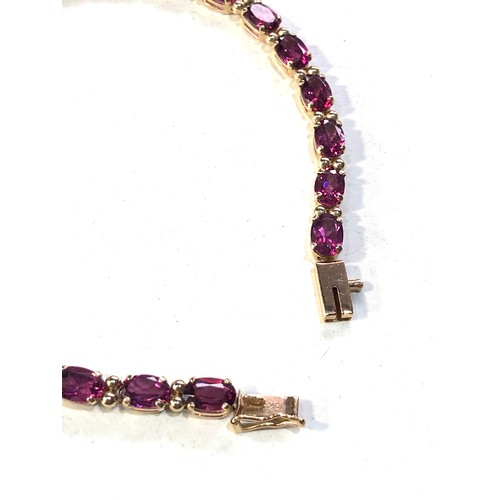 381 - 10ct gold gem set bracelet  measures approx 19cm long by 4mm wide weight 7.4g