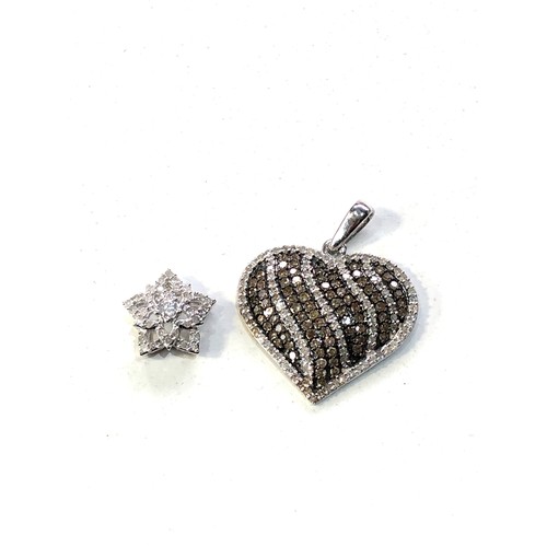 389 - 2 9ct white gold diamond pendants weight 5.1g heart pendant measures approx 3cm drop by 2.5cm wide