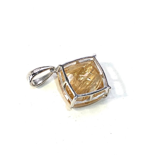 391 - 9ct white gold rutilated quartz pendant measures approx 2.9cm drop by 2cm wide weight 3.6g