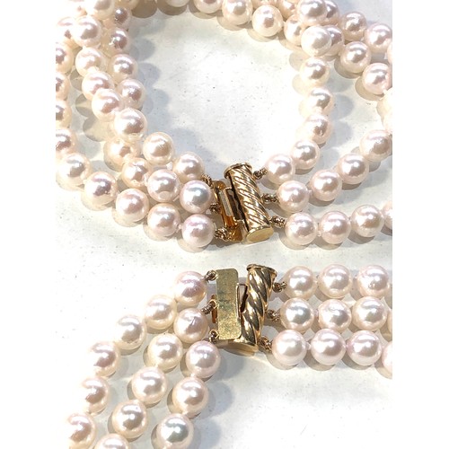 393 - 2 14ct gold clasp cultured pearl bracelets weight 88g