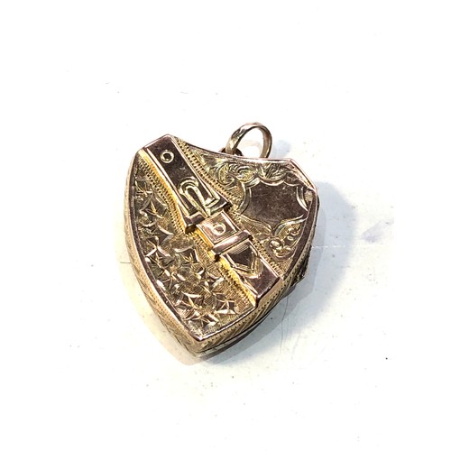 394 - Antique 9ct gold sheild and buckle locket measutres approx 2.7cm drop by 2cm wide weight 2.8g