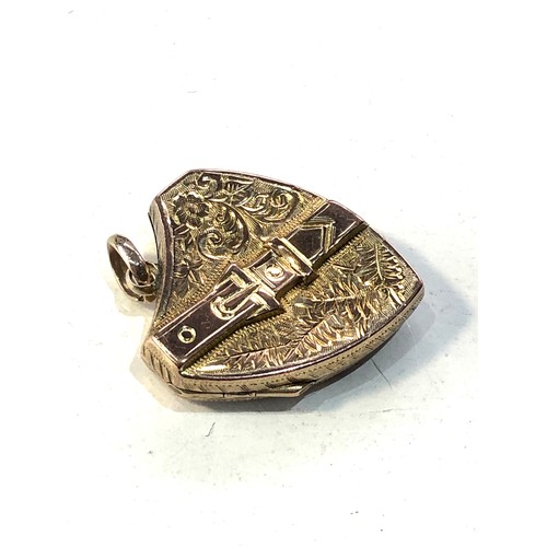 394 - Antique 9ct gold sheild and buckle locket measutres approx 2.7cm drop by 2cm wide weight 2.8g