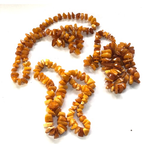 65 - 3 antique egg yolk amber bead piece necklaces total weight 186g