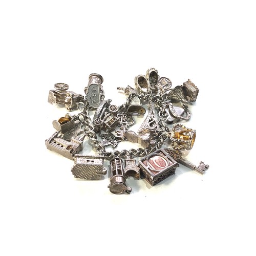 334 - Heavy Vintage silver charm bracelet and charms weight 97g