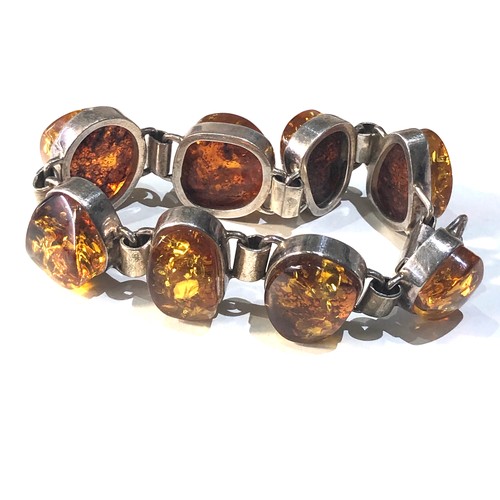 340 - Vintage chunky silver and amber bracelet measures approx 18.5cm long by 2.3cm wide weight 52g