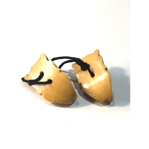 509 - 2 Japanese ivory noh mask netsuke of Hannya each measures approx 3.3cm by 2cm attached to a cord