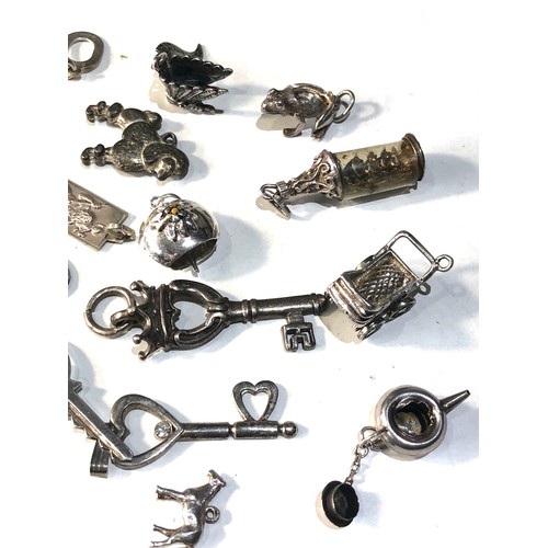 346 - Selection of vintage silver charms weight 50g