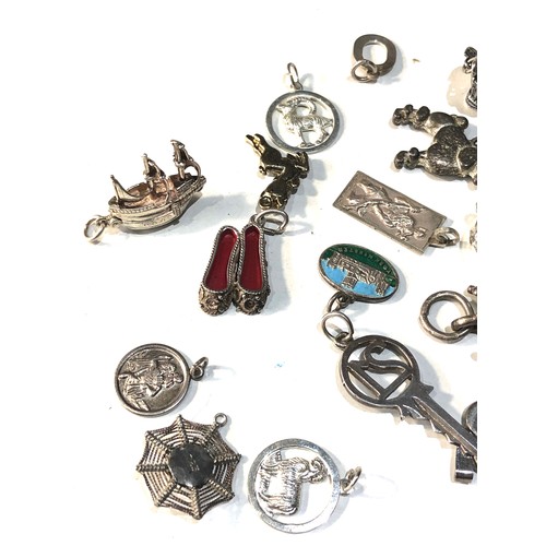 346 - Selection of vintage silver charms weight 50g