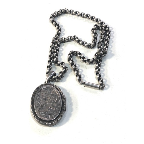 401 - Victorian silver locket and chain locket measures approx 4.5cm drop by 2.6cm wide