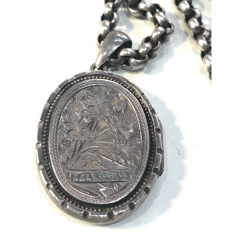 401 - Victorian silver locket and chain locket measures approx 4.5cm drop by 2.6cm wide