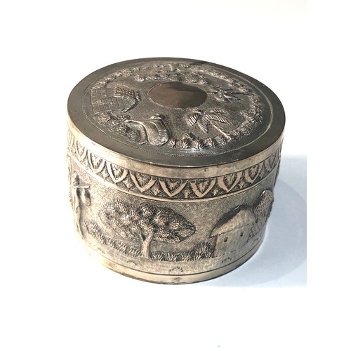 36 - Antique indian silver trinket box scenic embossed design  measures approx 7cm dia height 5cm xrt 800... 