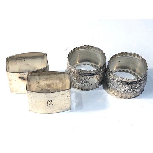 16 - 2 boxed pairs of antique silver napkin / serviette rings