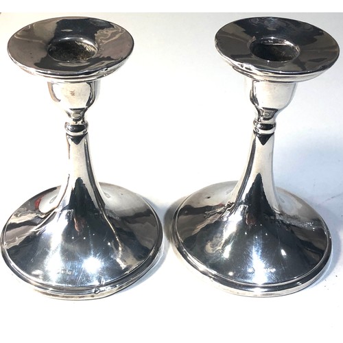45 - Pair of vintage silver candle sticks Birmingham silver hallmarks base measures approx 9.5cm dia heig... 