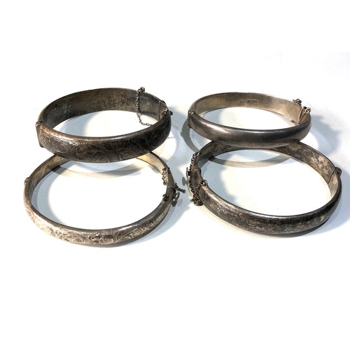 369 - 4 vintage silver bangles 64g