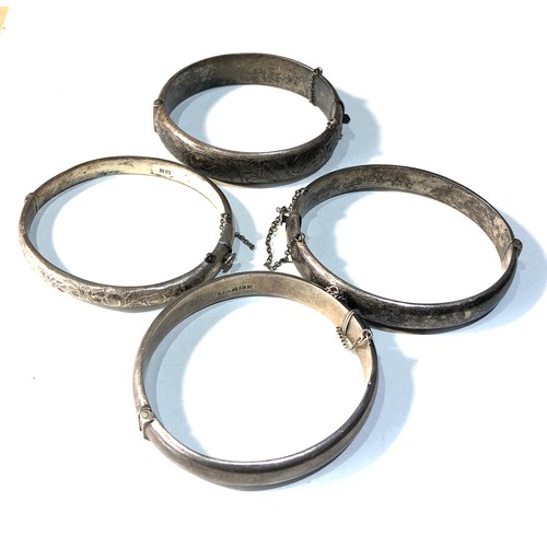 369 - 4 vintage silver bangles 64g