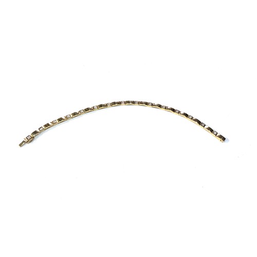 172 - 9ct gold diamond bracelet measures approx 20cm long by 3mm wide weight 8.6g good condition