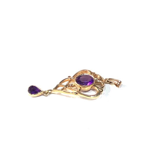 326 - 9ct gold amethyst pendant measures approx 5.1cm drop by 1.9cm weight 4g