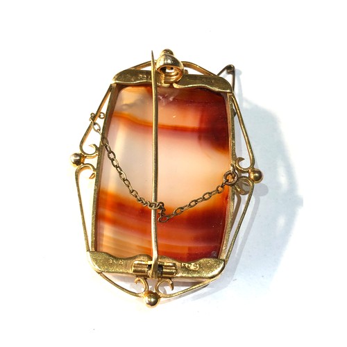 310 - 9ct gold banded agate brooch measures approx 5.7cm by 4cm weight 20.2g