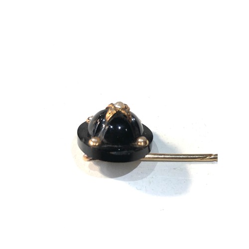 291 - Antique 9ct gold onyx & seed-pearl pin measures approx 8cmlong head diameter 1.4cm